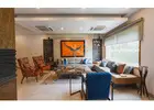 How do luxury interior designers manage budgets while still delivering high-end results?
